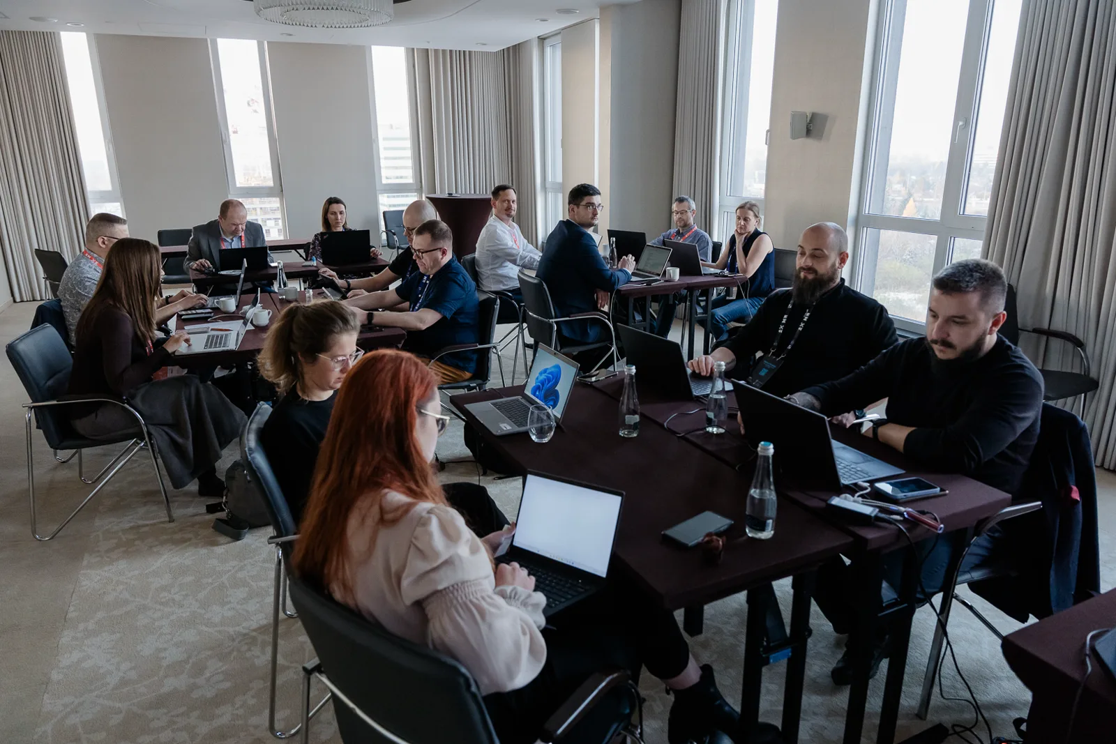 Workshop participants with laptops working on their own prompts